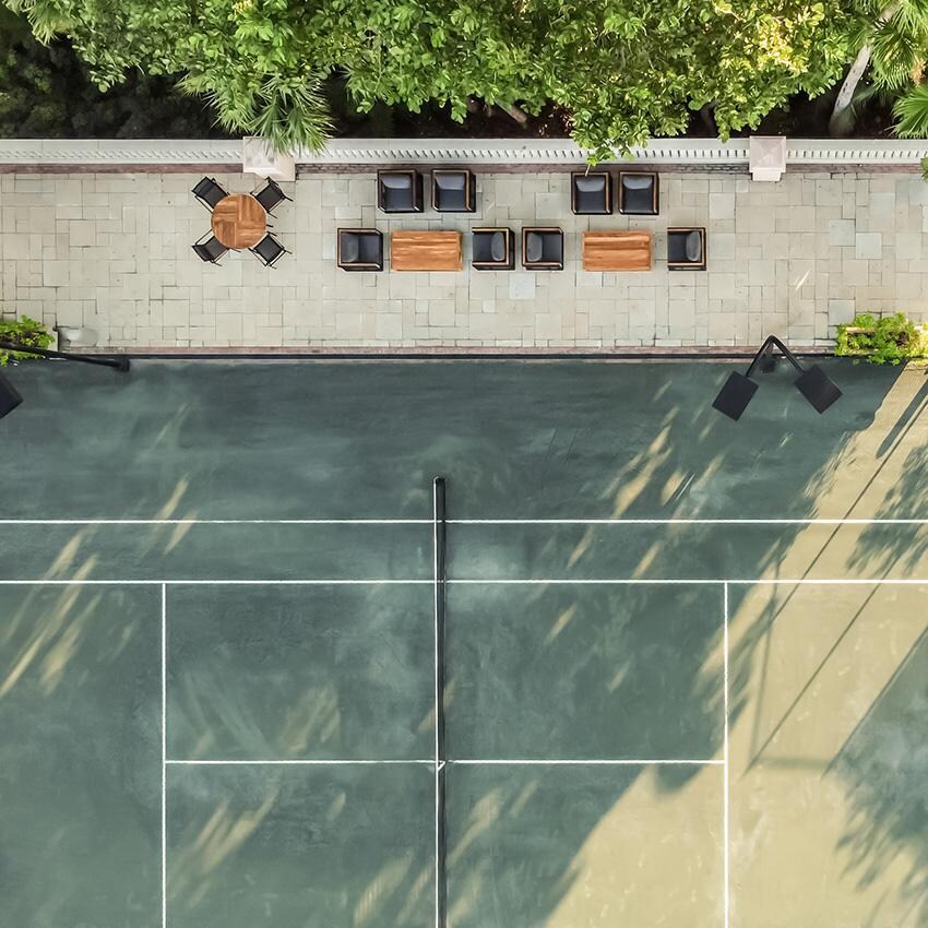 Teak + Table St Barts Aluminum Stacking Dining Chair in White - Top View Tennis Courts - Lifestyle thumbnail