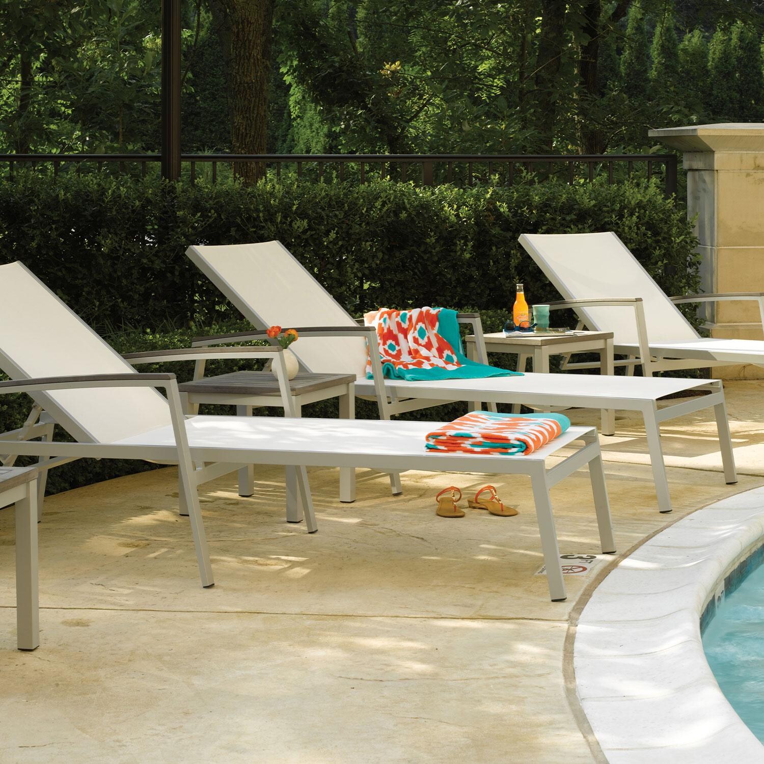 Travira 8 Pc Powder-Coated Aluminum Chaise Lounge Set in Natural/Vintage/Flint By Oxford Garden - Close Up - Lifestyle thumbnail