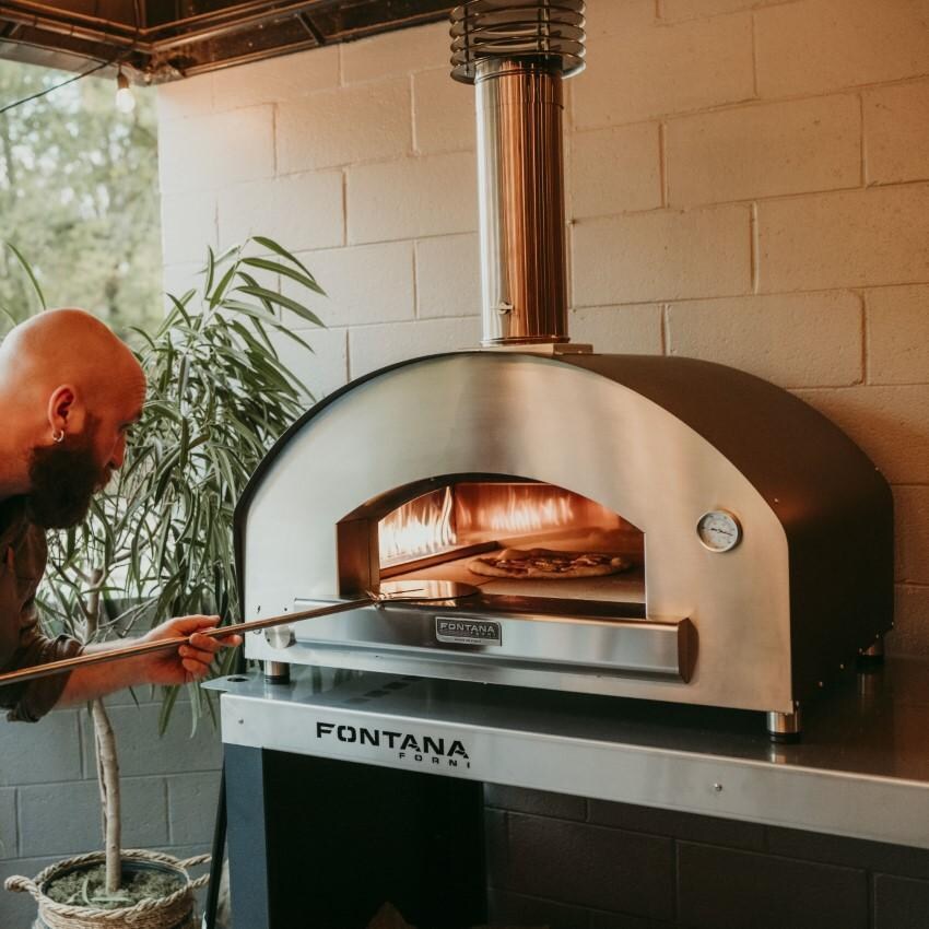 Fontana Forni FTFIR-H-R + FTCART-L Firenze Hybrid Pizza Oven on Cart - Red - Pizza Paddle - Lifestyle thumbnail