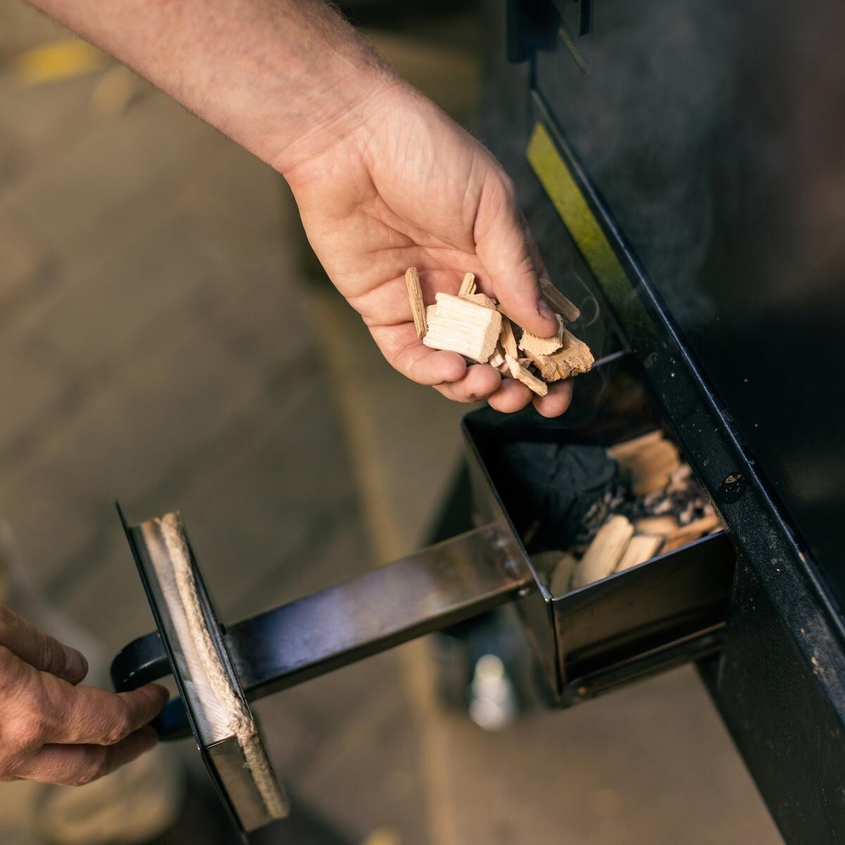 Camp Chef PGSBXXL XXL Pro WIFI Vertical Smoker - Loading the Smoke Box - Lifestyle thumbnail