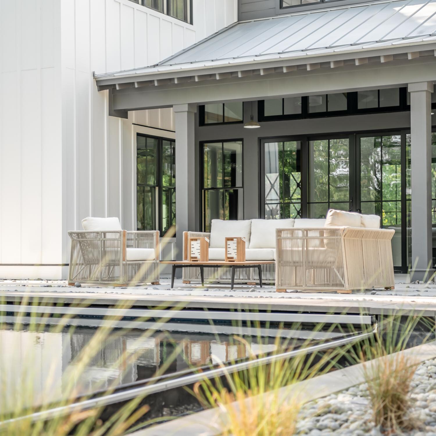 Teak + Table Breeze Olefin Rope & Teak Patio Club Chair in Dune/Natural - On Patio - Lifestyle thumbnail