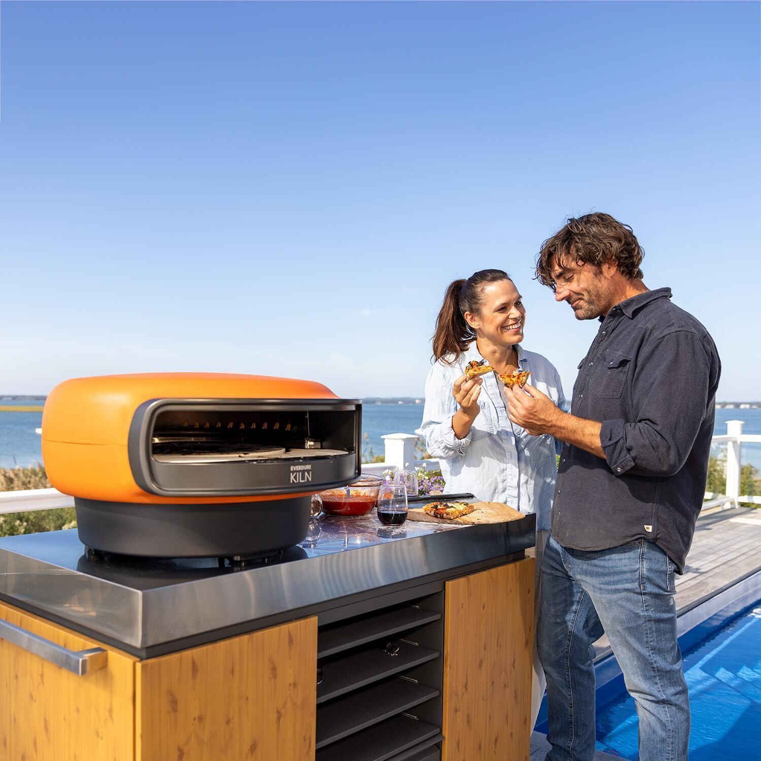 Everdure EKILN1TUS 1-Burner KILN Pizza Oven - Terracotta - Eating Pizza - Lifestyle thumbnail