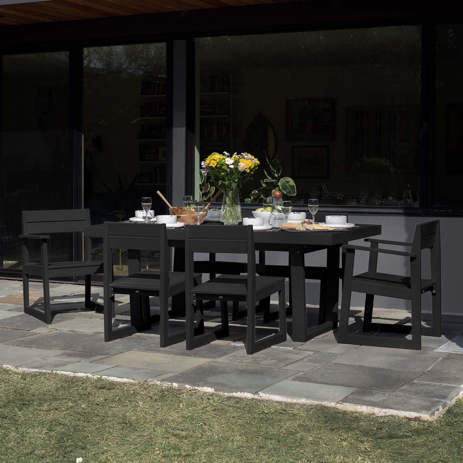 Hazel Cove 7 Pc Recycled Plastic Dining Set in Black Sand by Lakeview Outdoor Designs - Side View - Lifestyle thumbnail