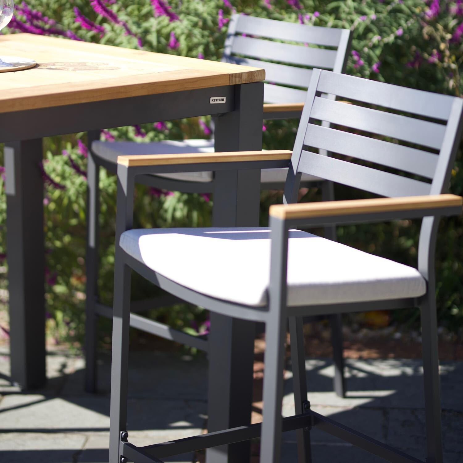 Elba 5 Pc Aluminum/Teak Dining Bar Set w/ Arm Chairs By KETTLER - Bar Chair - Side View - Lifestyle thumbnail