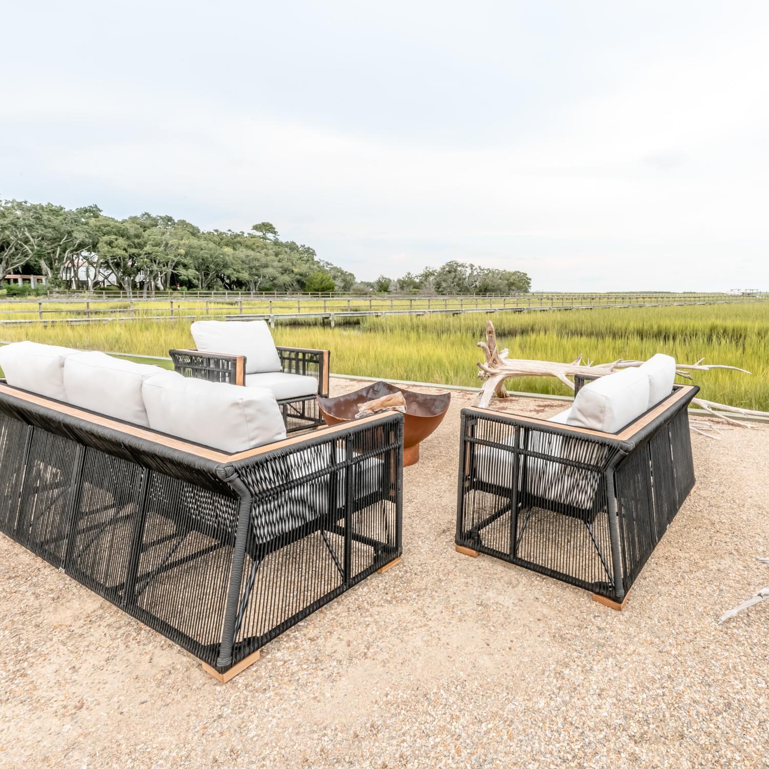 Teak + Table Breeze Olefin Rope & Teak Patio Loveseat in Charcoal/Natural - Around the Firepit, Side View - Lifestyle thumbnail