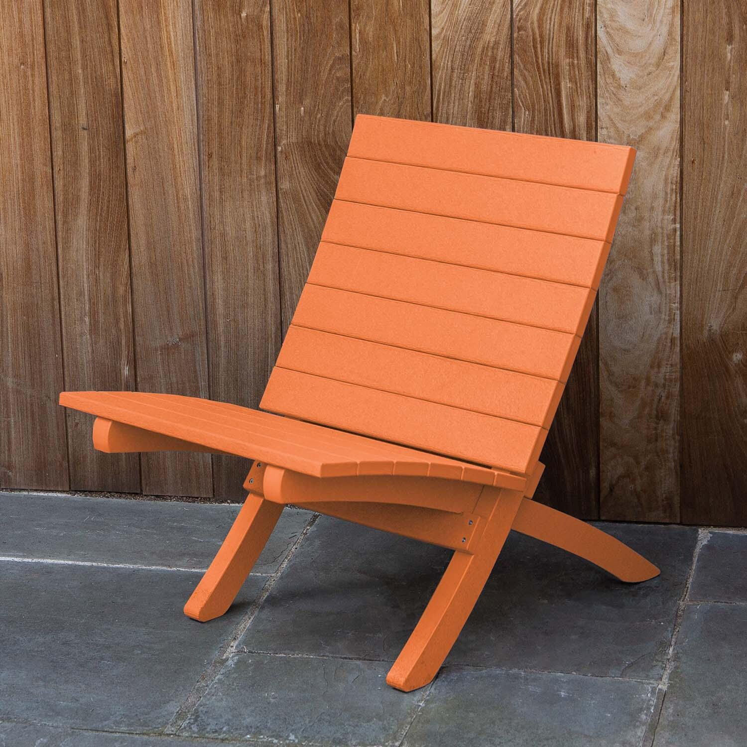 Hazel Cove Recycled Plastic Folding & Stacking Dining Side Chair in Citrus Orange by Lakeview Outdoor Designs - Lifestyle thumbnail
