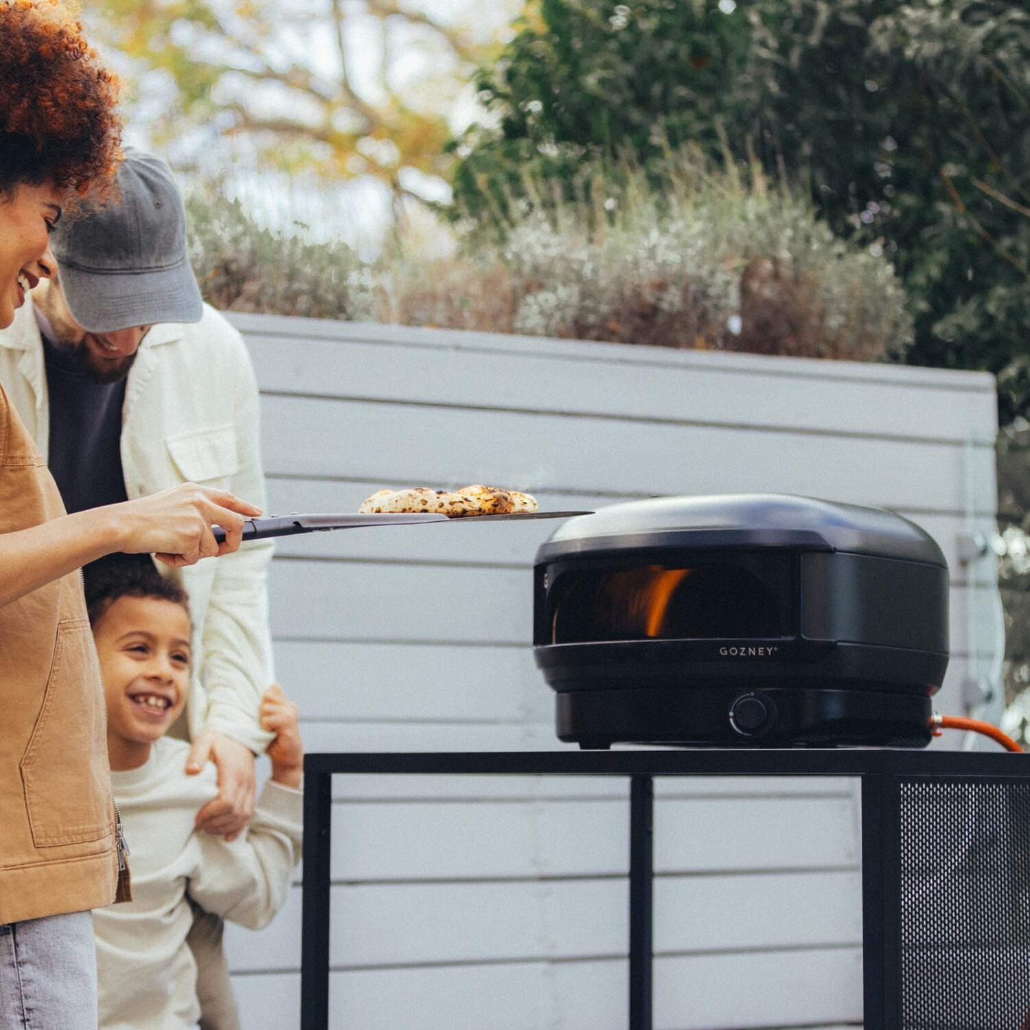 Gozney GAPOBUS1226 Black Arc Lite Propane Pizza Oven Bundle - Family Pizza Night - Lifestyle thumbnail