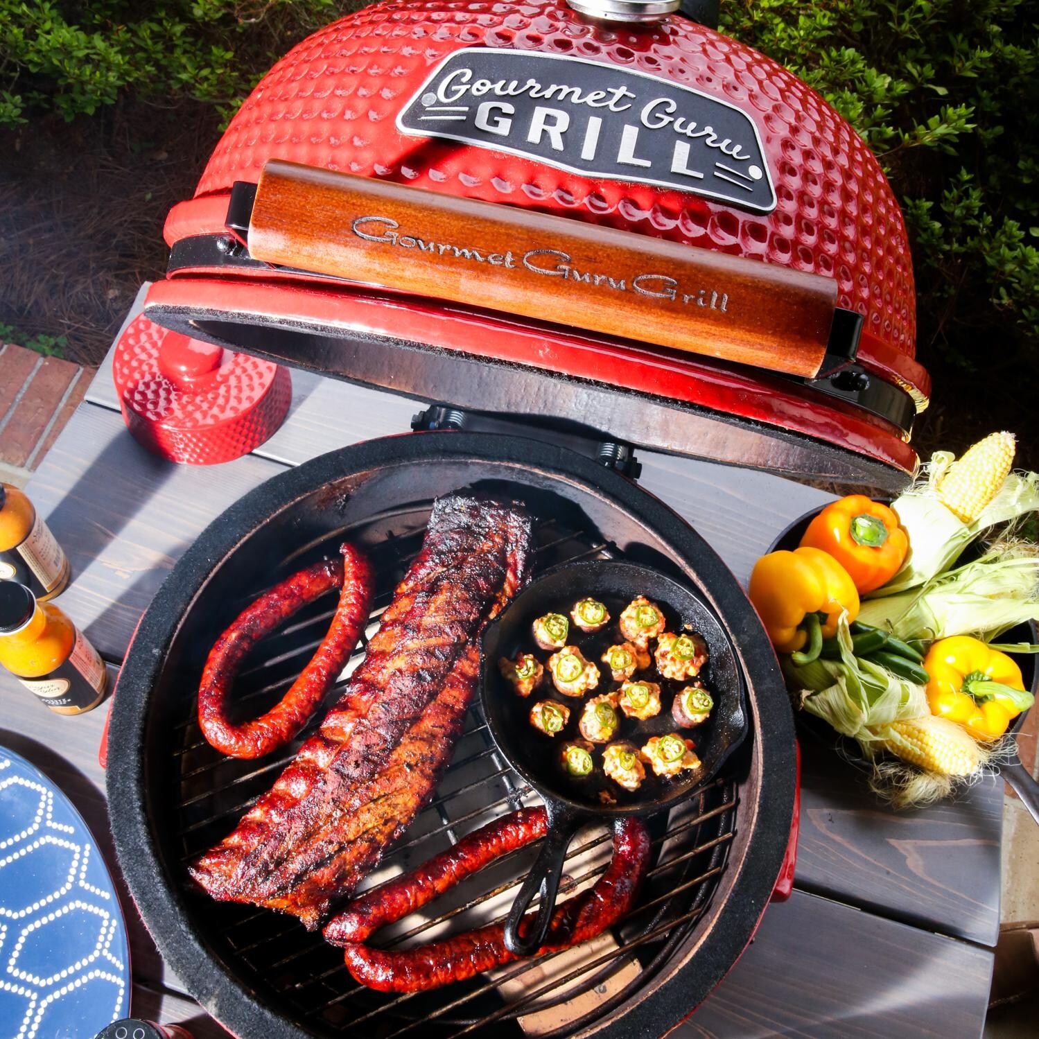 Gourmet Guru Ceramic Kamado Grill On Cypress Wood Vintage Table Red
