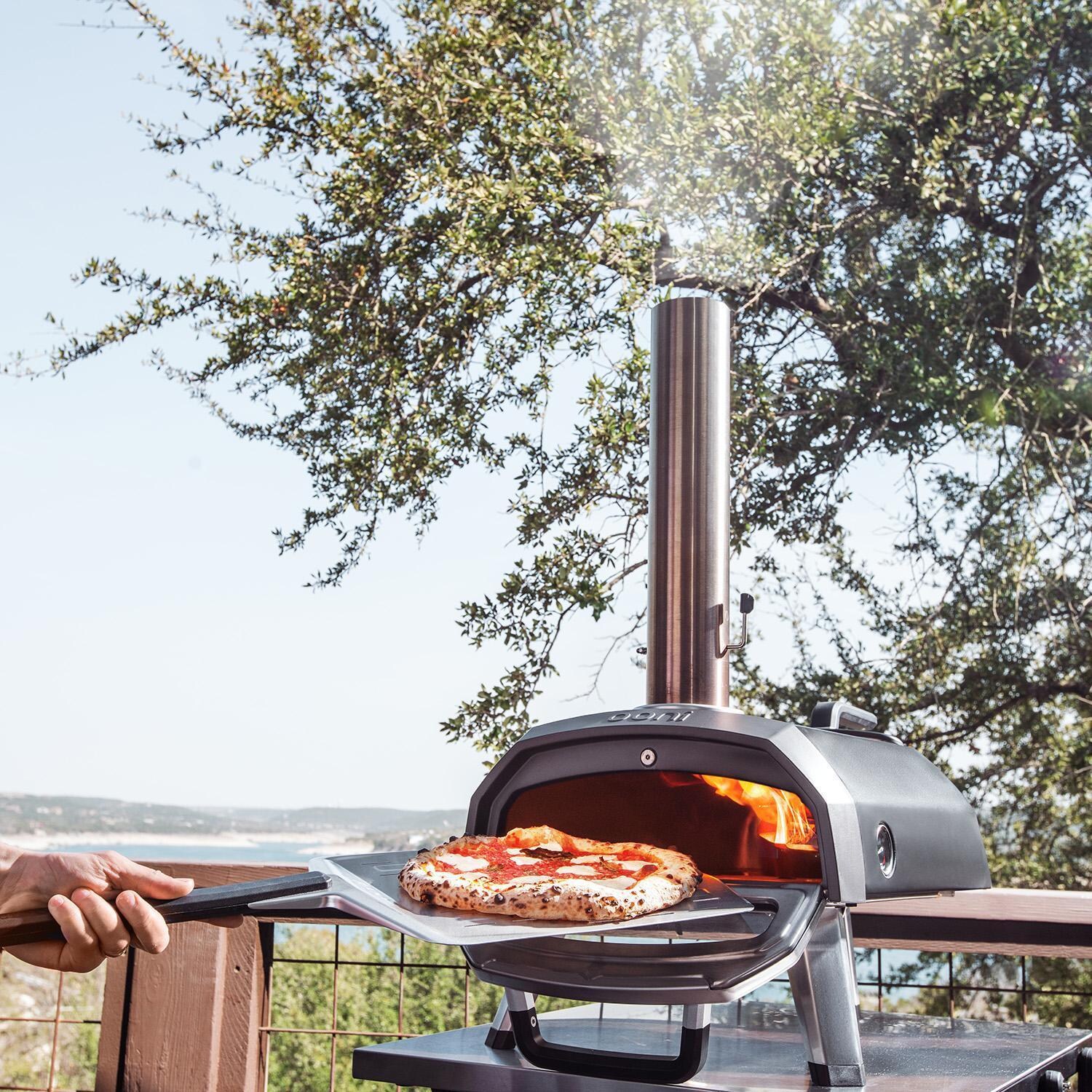 Ooni UU-P25100 Karu 12G Multi-Fuel Portable Pizza Oven - Baked Pizza - Lifestyle thumbnail