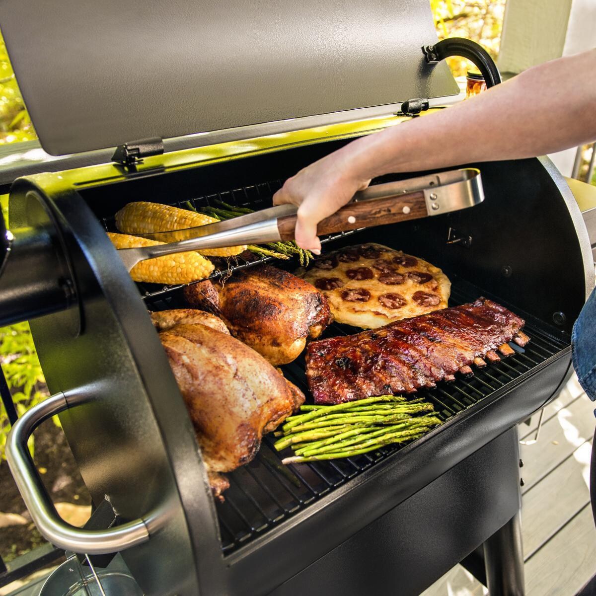 Traeger TFB57GLE Pro 575 Bronze Wood Pellet Grill - With Food - Lifestyle thumbnail