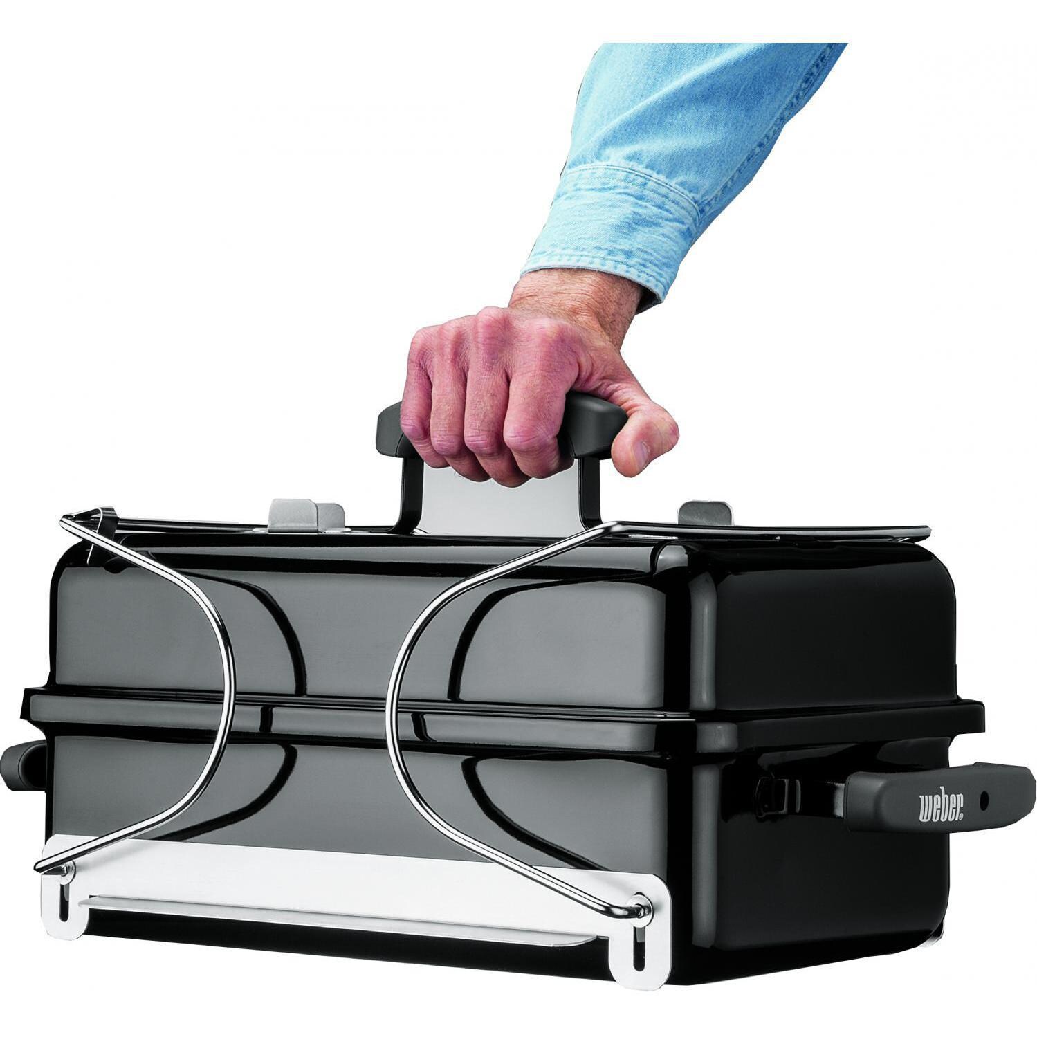 Weber 121020 Go-Anywhere Portable Charcoal Grill - Being Carried - White Background thumbnail