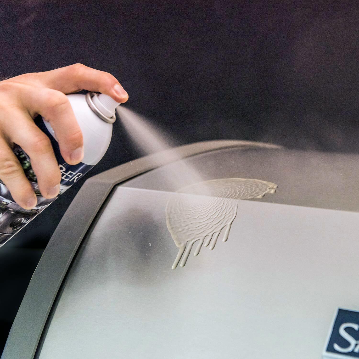Saber Exterior Grill Cleaner and Polish - Shown Cleaning A Saber Grill Hood thumbnail