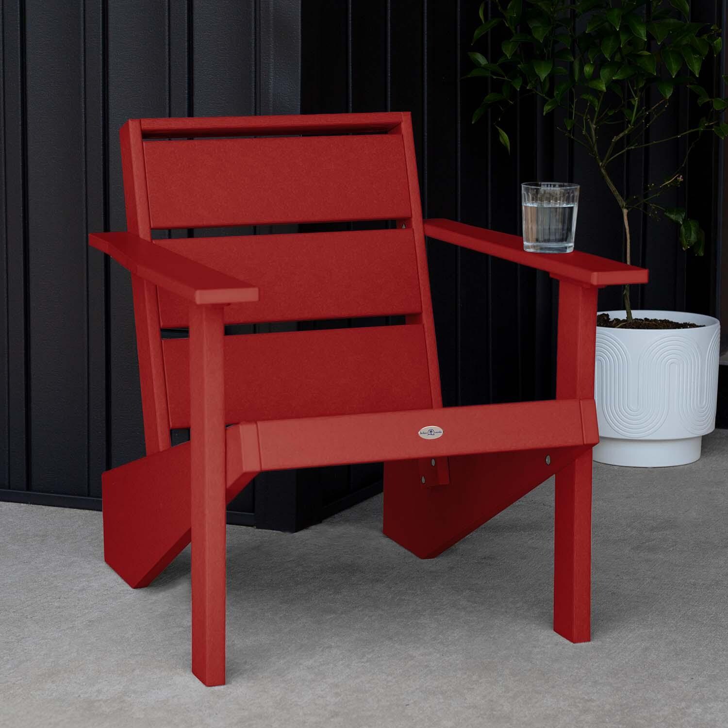 Hazel Cove Recycled Plastic Adirondack Chair in Boathouse Red by Lakeview Outdoor Designs - Next to Flowerpot - Lifestyle thumbnail