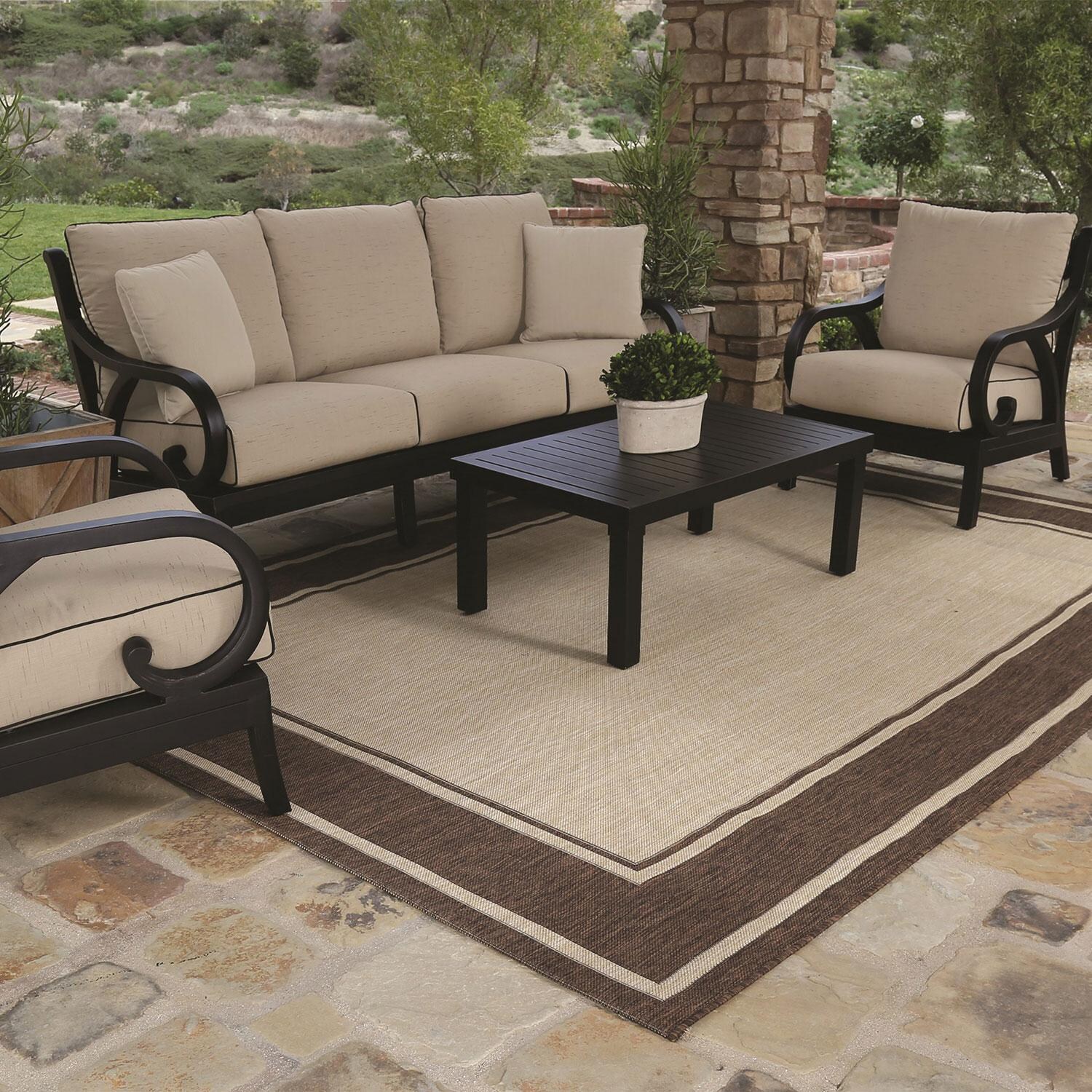 Monterey 3 Person Aluminum Patio Sofa in Spectrum Carbon w/ Self Welt By Sunset West - Under Porch - Styled W/ Furniture Shown in Canvas Natural finish (Sold Separately) - Lifestyle thumbnail