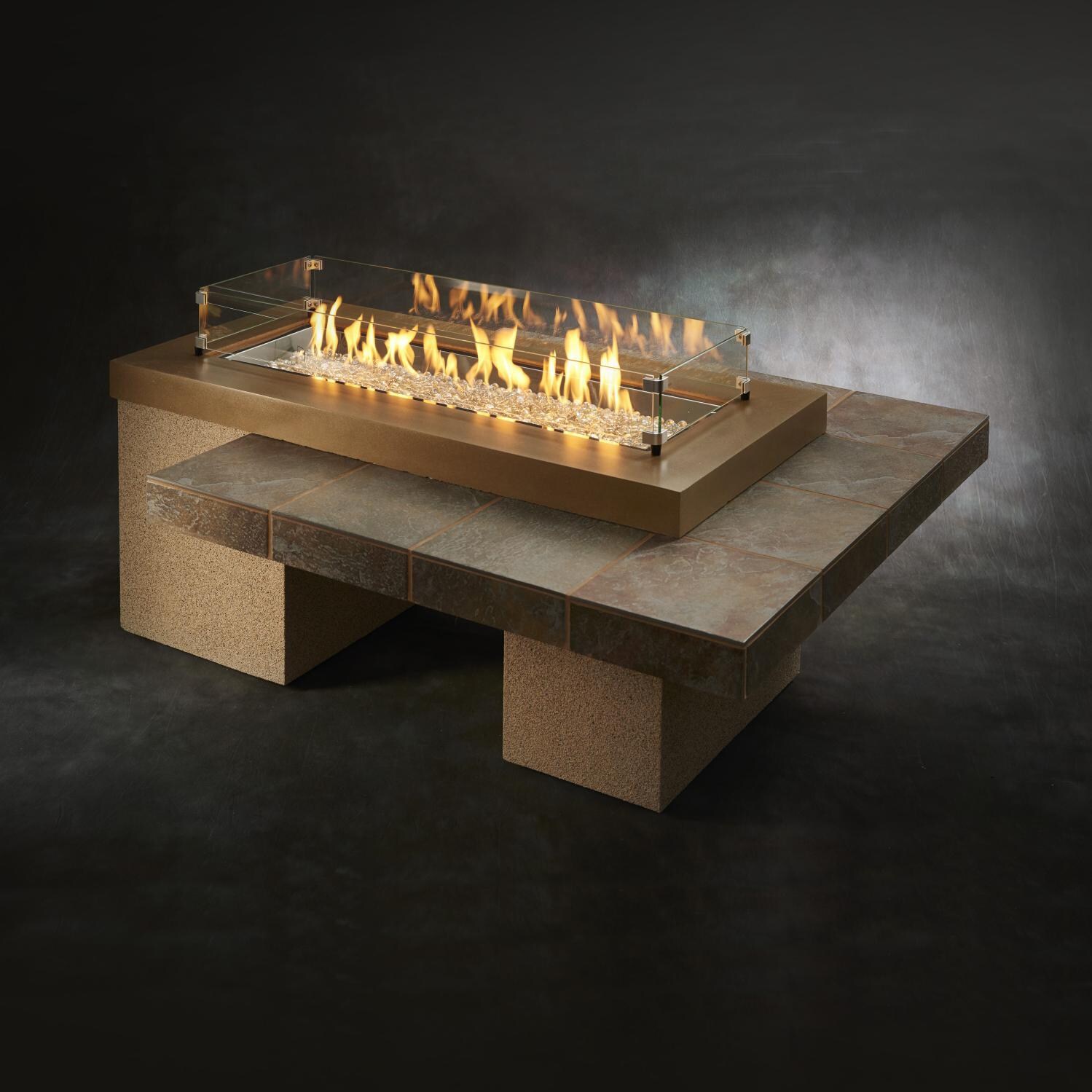 The Outdoor GreatRoom Company Uptown Linear Gas Fire Pit Table - Brown - Lifestyle - Glass wind guard pictured is optional accessory thumbnail