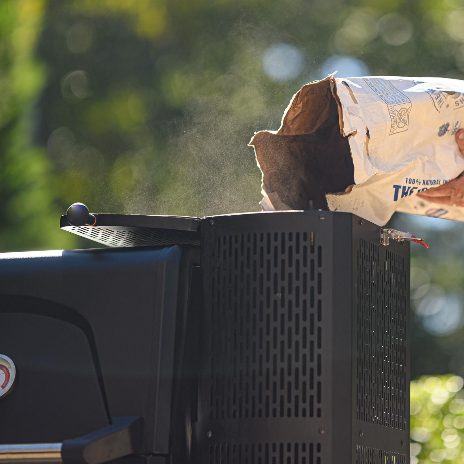 Masterbuilt - MB20040220 - Gravity Series 560 Digital Charcoal Grill + Smoker - Pouring Charcoal thumbnail