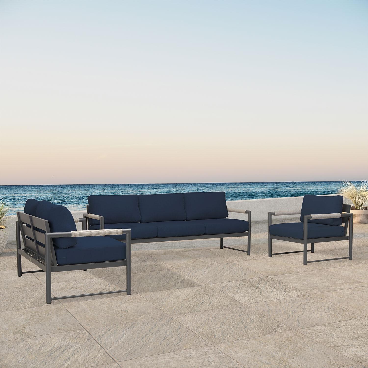 Lakeview AVEBAY-SL-PG-SET143-IN Avenue Bay Slate/Pebble Gray 3 Pc Sofa Loveseat Set - Spectrum Indigo - Angled On Patio - Lifestyle thumbnail