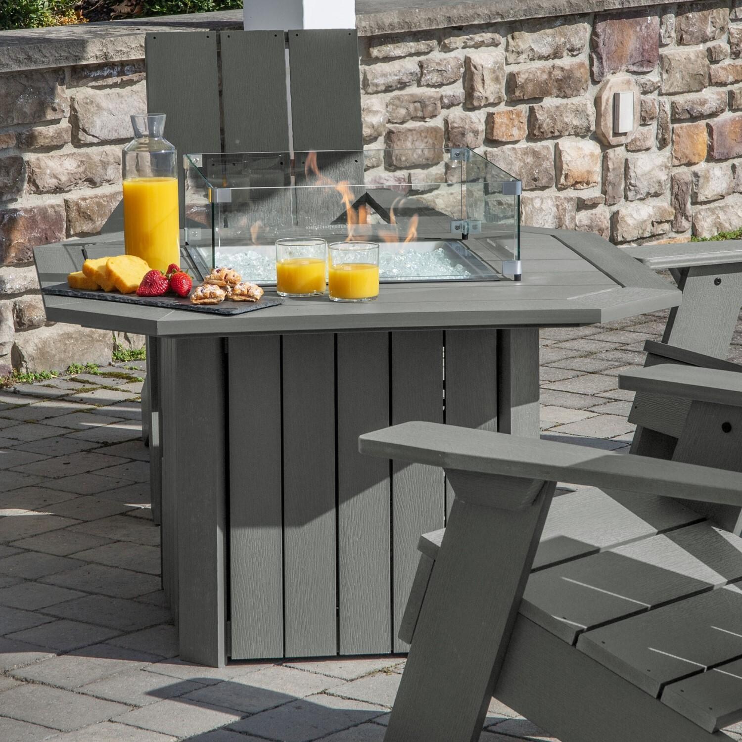 Harborview 5 Pc Adirondack Set W/ Fire Pit Table in Coastal Teak by Lakeview Outdoor Designs - Side View Table - Lifestyle thumbnail