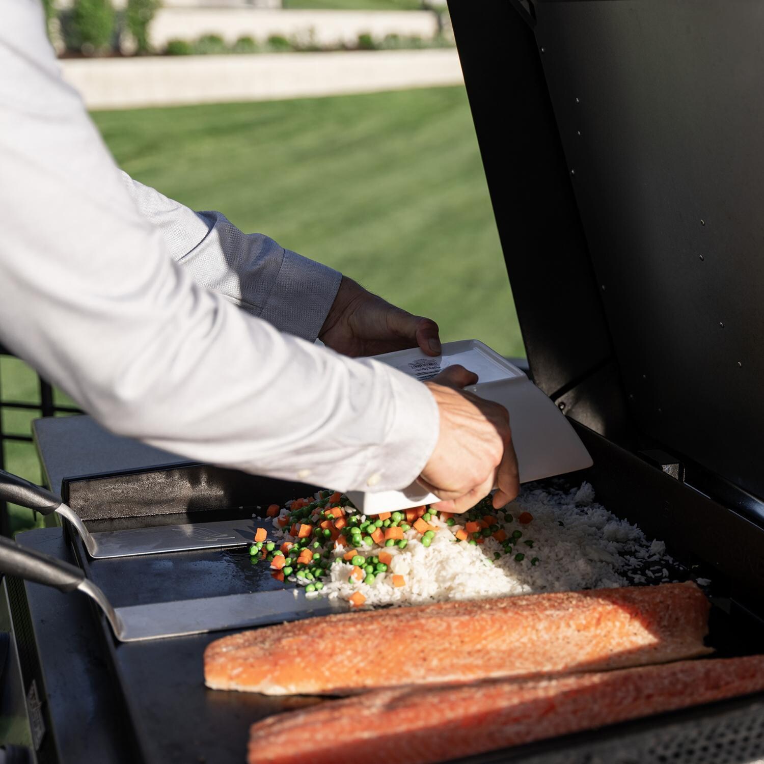 Blackstone 6332 28-in XL Built-In Propane Griddle w / Hood - Grill In Use Angled View - Lifestyle thumbnail
