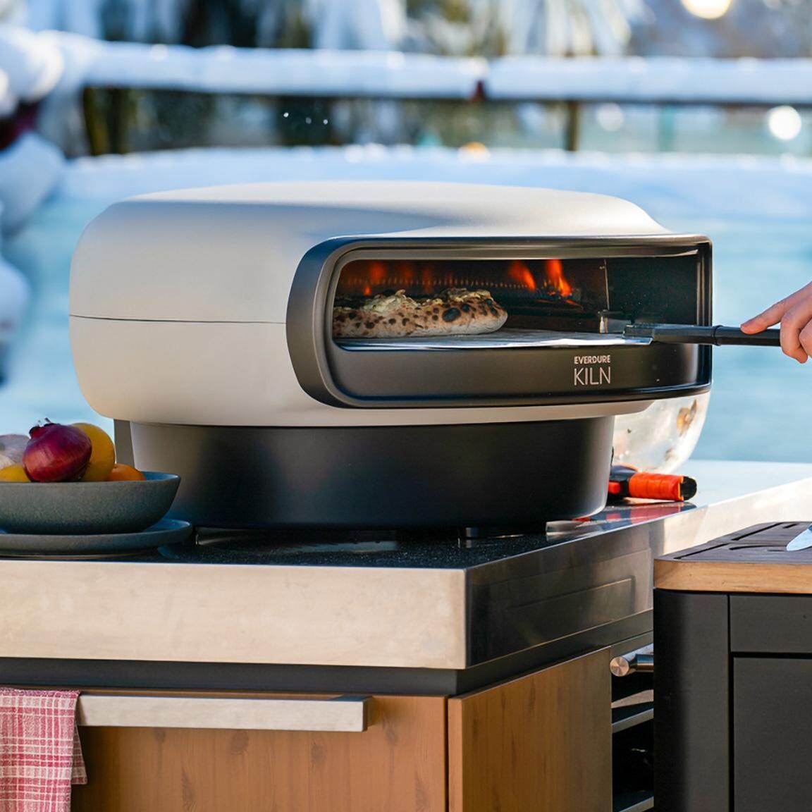 Everdure EKILN2SUSNG 2-Burner KILN Pizza Oven - Stone - Cooking in Winter - Lifestyle thumbnail