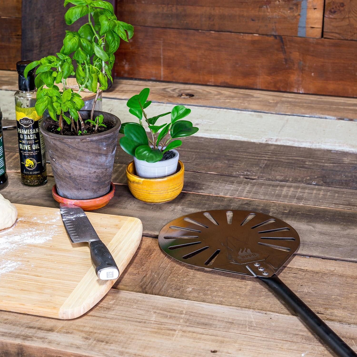 WPPO WKPA-9peel 9-in Round Aluminum Pro Turning Pizza Peel - Lifestyle thumbnail