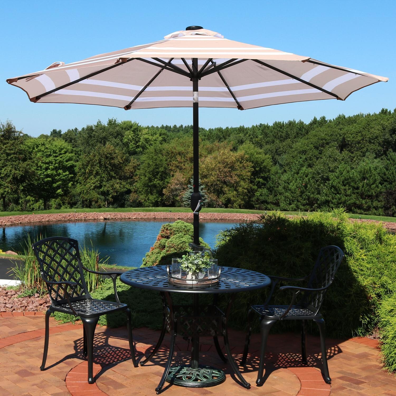 Ultimate Patio 9 Ft. Solar Lighted Octagonal Patio Umbrella W/ Crank Lift - Beige Stripe Canopy - Lifestyle View thumbnail