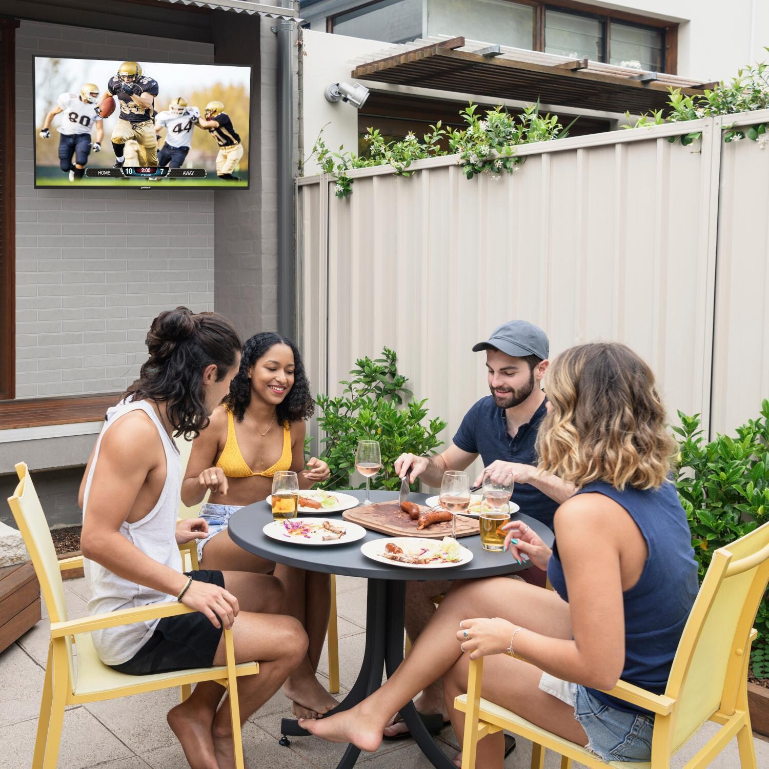 Neptune WPTV553 55-Inch Partial Sun Outdoor Smart TV - On Patio - Lifestyle thumbnail