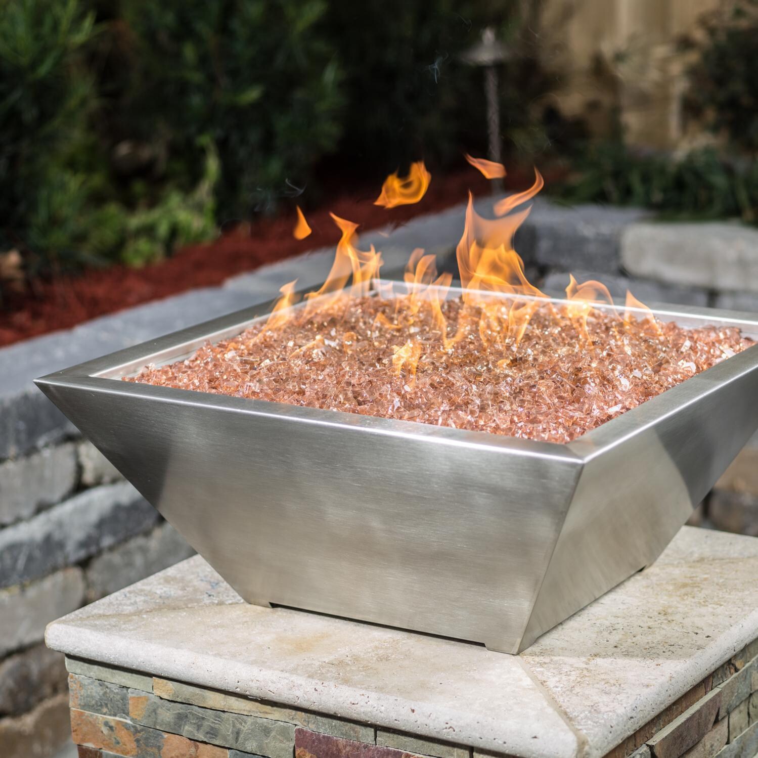 BBQGuys Signature Series Westfalen 24-Inch Square High-Rise Propane Fire Bowl - Stainless Steel - Angled - Shown with 1/2 inch Sunset Amber Non-reflective Fire Glass (Sold Separately) thumbnail