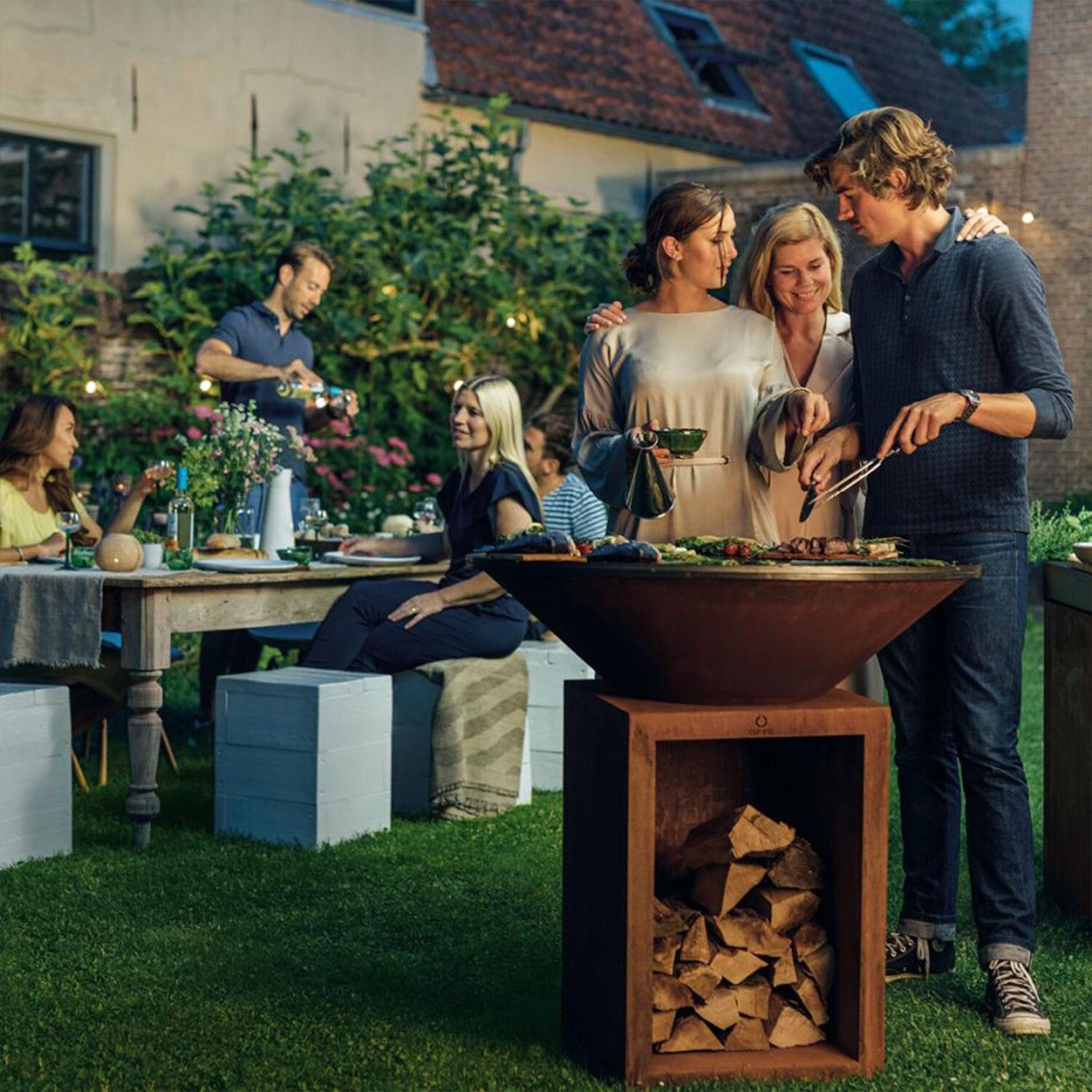 OFYR OCS-100 Classic Storage Corten 100 40 Inch Wood-Fired Flat Top Grill - Backyard Gathering - Lifestyle thumbnail