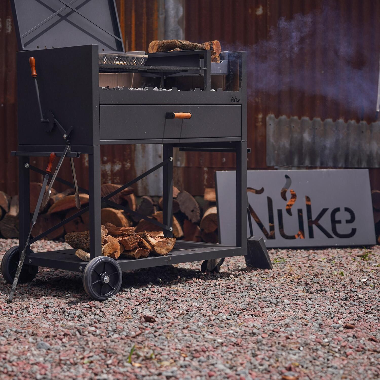 Nuke DELTA02 Delta 40-Inch Argentinian-Style Gaucho Grill - Angled View - Lifestyle thumbnail