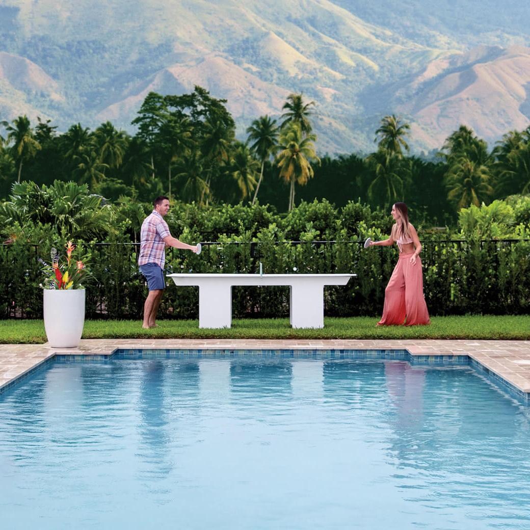 Ledge Lounger Ping Pong Table - White w/Sky Blue Net & Paddle Accent - Lifestyle thumbnail