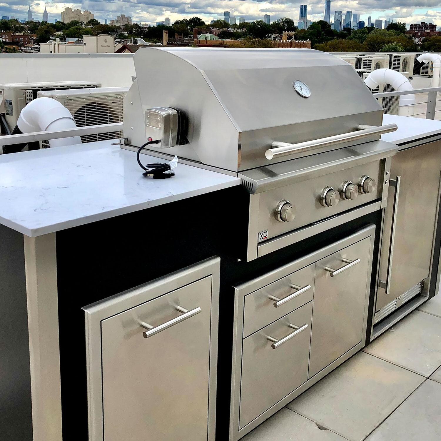 XO Designer 8 1/2 Ft Outdoor Kitchen Island w/ 36-in Natural Gas Pro-Grade Grill, Door & Drawer, Trash Drawer & Outdoor Refrigerator in White - Close Up - Shown in Black finish - Lifestyle thumbnail