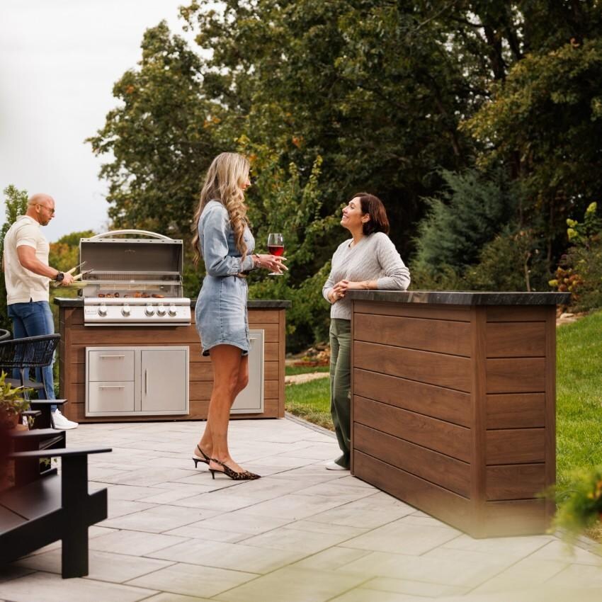 BBQGuys Signature 72 Inch 360 Degree Swivel Outdoor TV Lift Cabinet | Toffee w/ Black Granite - Screen Down - Lifestyle thumbnail