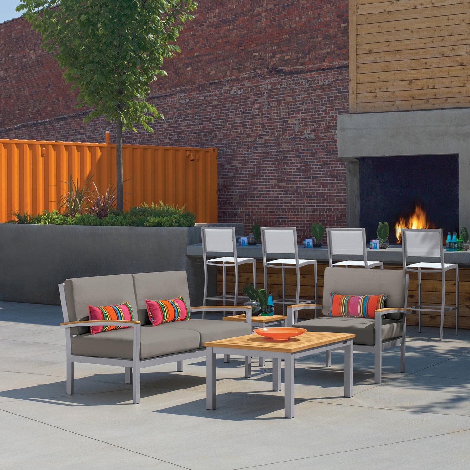 Oxford Garden 5055-PC.F Travira 4 Pc Aluminum Seating Set w/ Club Chair in Vintage Tekwood by Oxford Garden - On Patio - Lifestyle thumbnail