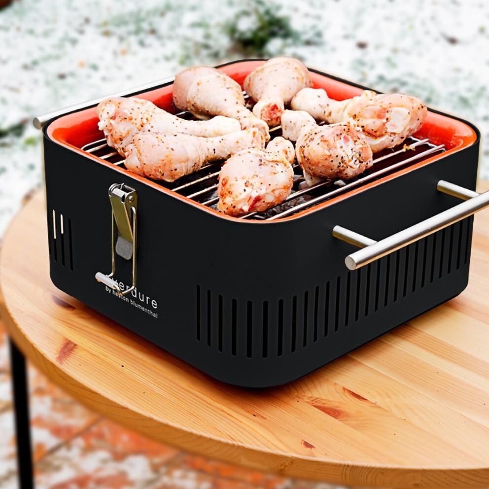 Everdure HBCUBEGUS Graphite CUBE 17 Inch Portable Charcoal Grill - Cooking Chicken - Lifestyle thumbnail