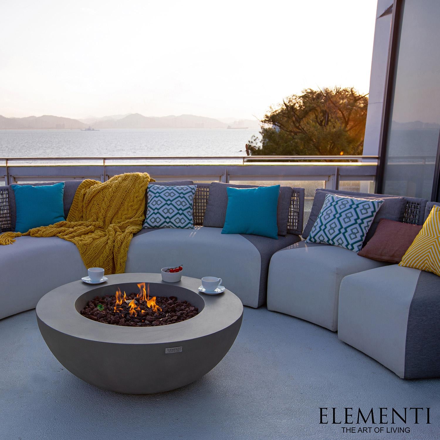 Elementi Lunar Bowl 42-in Natural Gas Concrete Fire Table in Light Grey - Shown w/ Couch - Lifestyle thumbnail