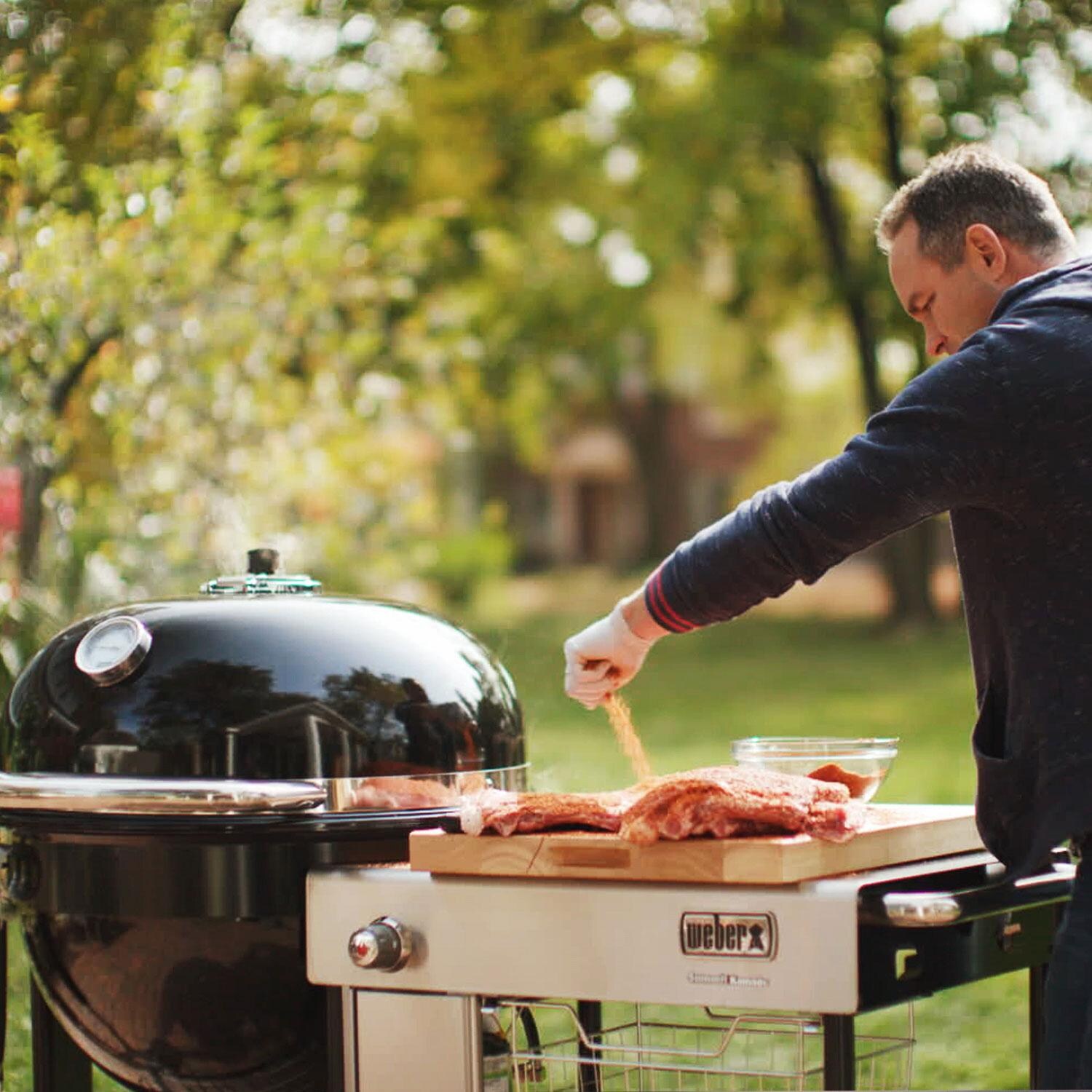 Weber 18501101 Summit 24-Inch Kamado S6 Charcoal Grill Center - Seasoning Meat - Lifestyle thumbnail