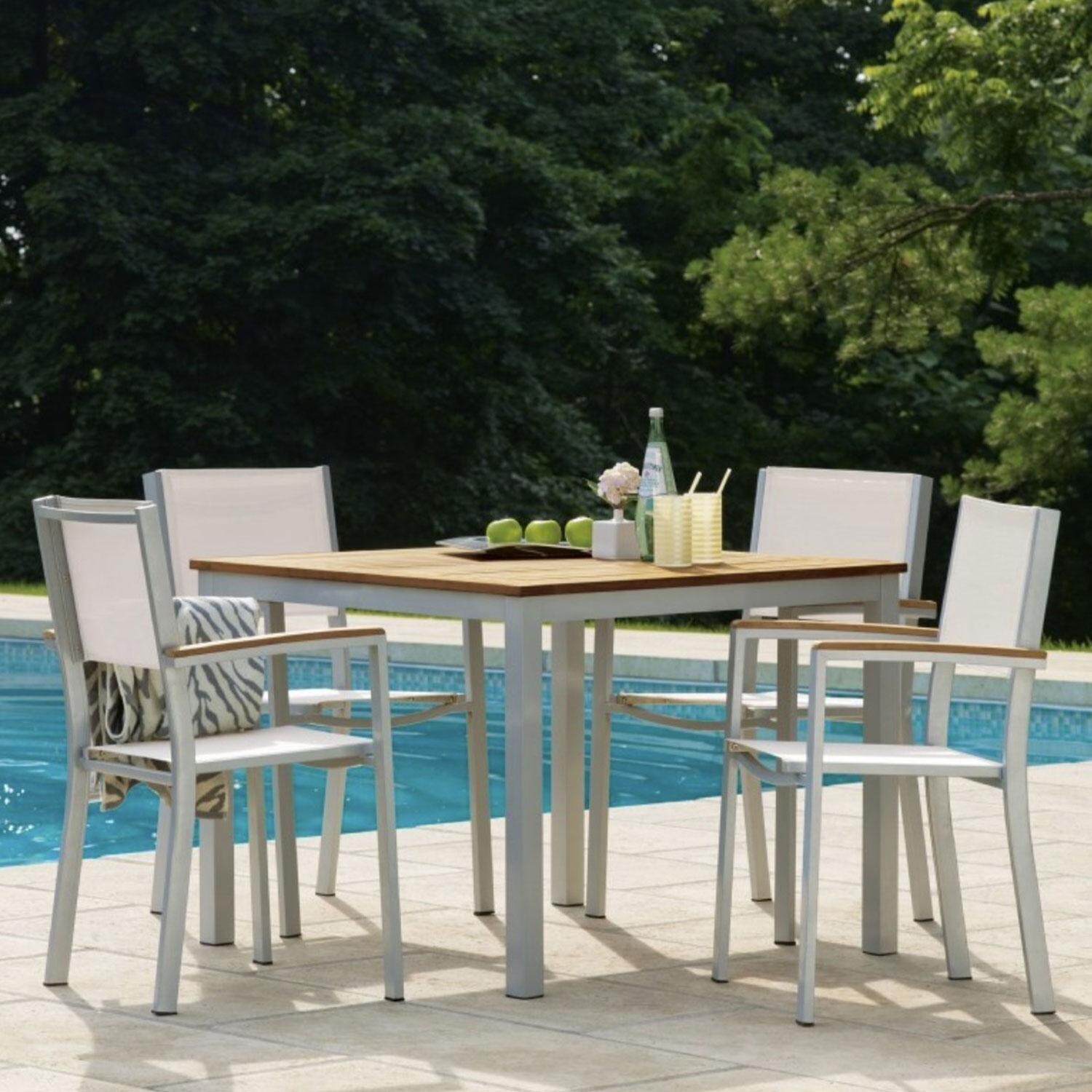 Travira Aluminum Dining Arm Chair W/ Natural Sling & Natural Tekwood Armcaps By Oxford Garden - Set Of 2 - Shown W/ Dining Set (Not Included) - Lifestyle thumbnail