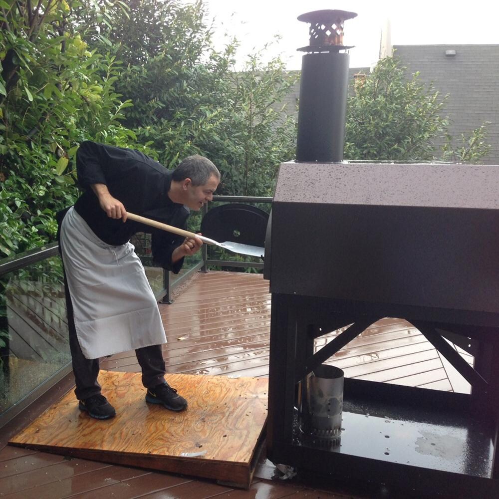 Chicago Brick Oven CBO-O-MBL-750-CV Mobile Stand Wood Fired Pizza Oven - Copper Vein - Chef at Work thumbnail