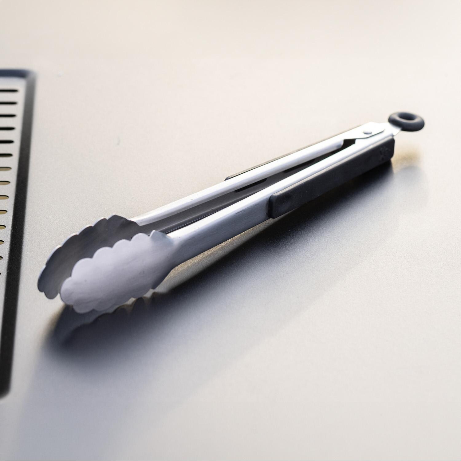 Camp Chef SPSET7 Griddle 7- Pc Essentials Kit - Tongs on Table - Detail thumbnail