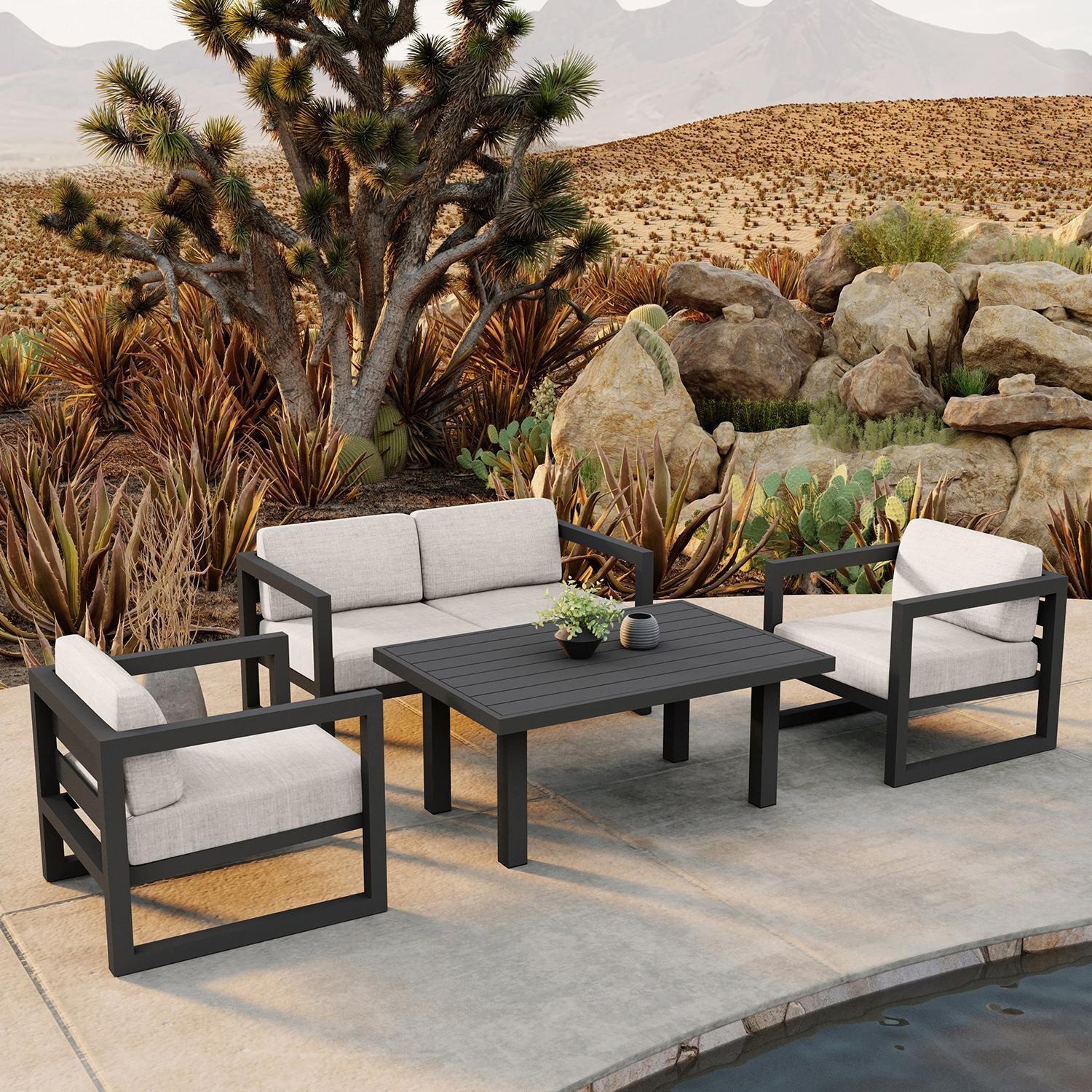 Misty Cove 4 Piece Seating Set in Slate w/Chat Table & Cast Silver Cushions by Lakeview - Lifestyle thumbnail