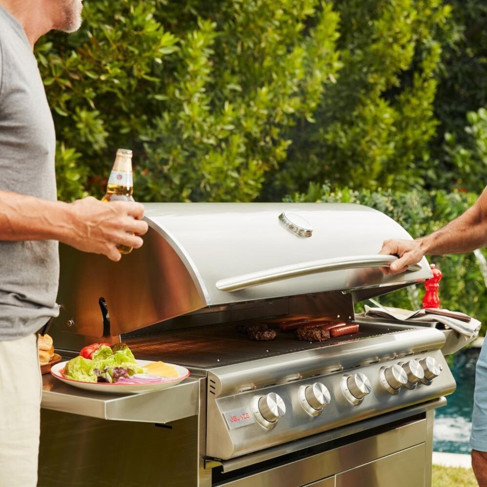 Blaze BLZ-5LTE3-LP Premium LTE+ 40-Inch 5-Burner Propane Grill With Rear Infrared Burner & Lift-Assist Hood - Men Chatting By Grill - Lifestyle thumbnail