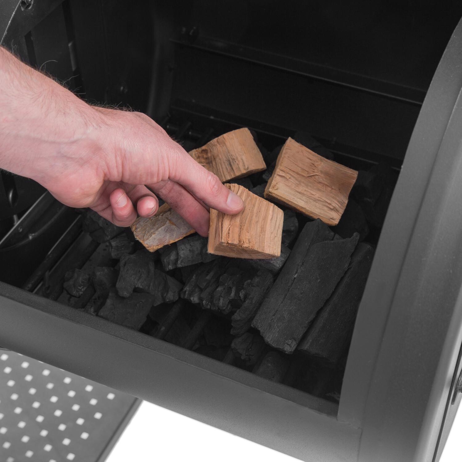 Broil King 958050 Regal Charcoal Offset 500 Smoker - Loading the Small Cooking Chamber - Lifestyle thumbnail