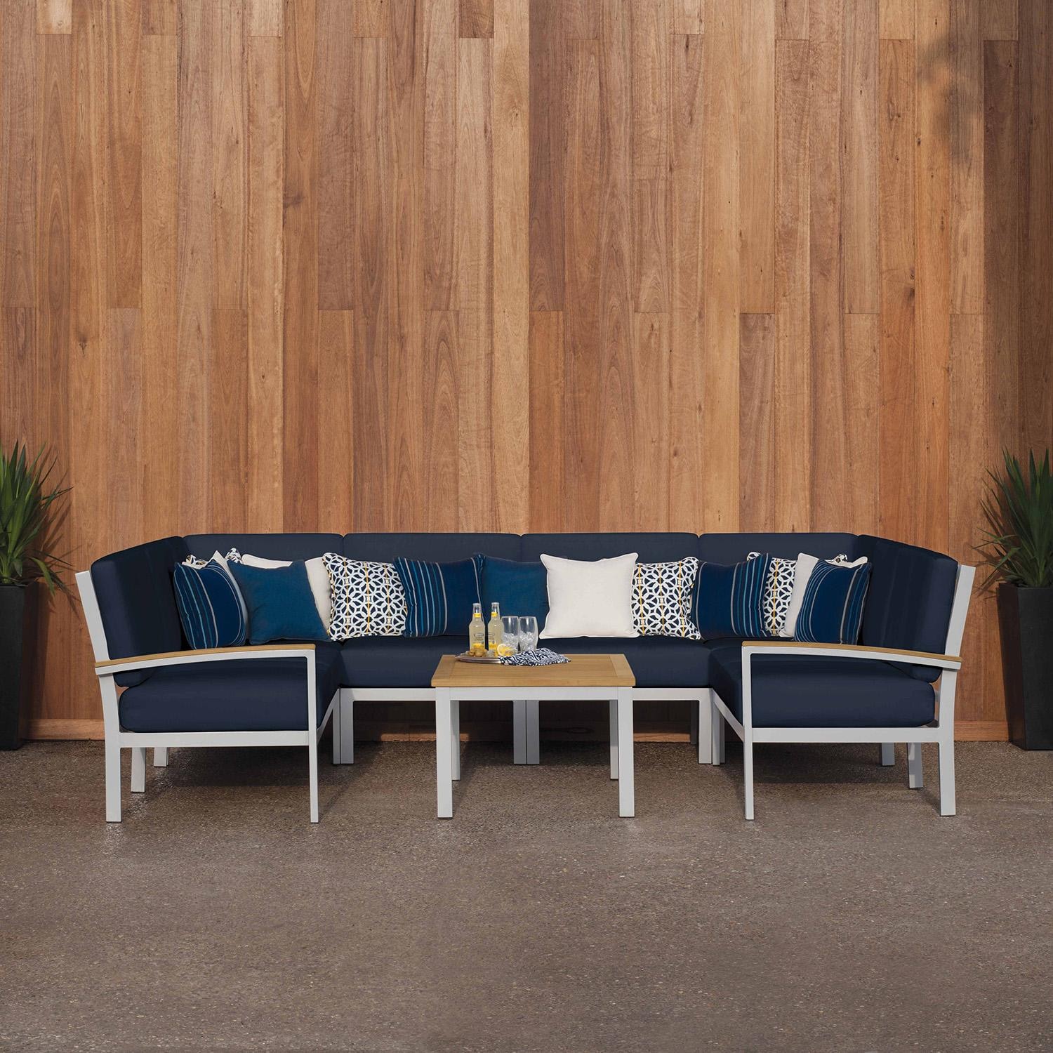 Oxford Garden 5259-PC.F Travira 7 Pc Aluminum Seating Set w/ Coffee Table in Natural Tekwood/ Midnight Blue by Oxford Garden - On Patio - Lifestyle thumbnail