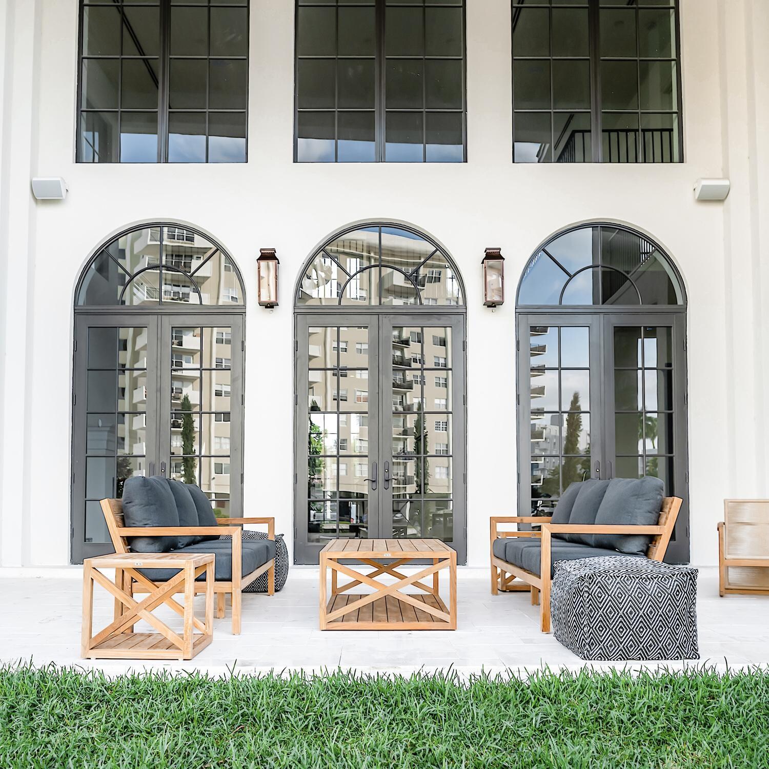 Teak + Table Monday Teak Patio Sofa in Natural - Landscape - Lifestyle thumbnail