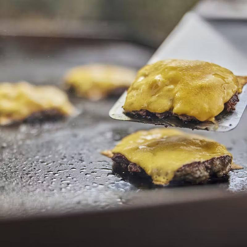 Weber 6779 Stainless Steel Griddle Spatula - Flipping Burgers thumbnail