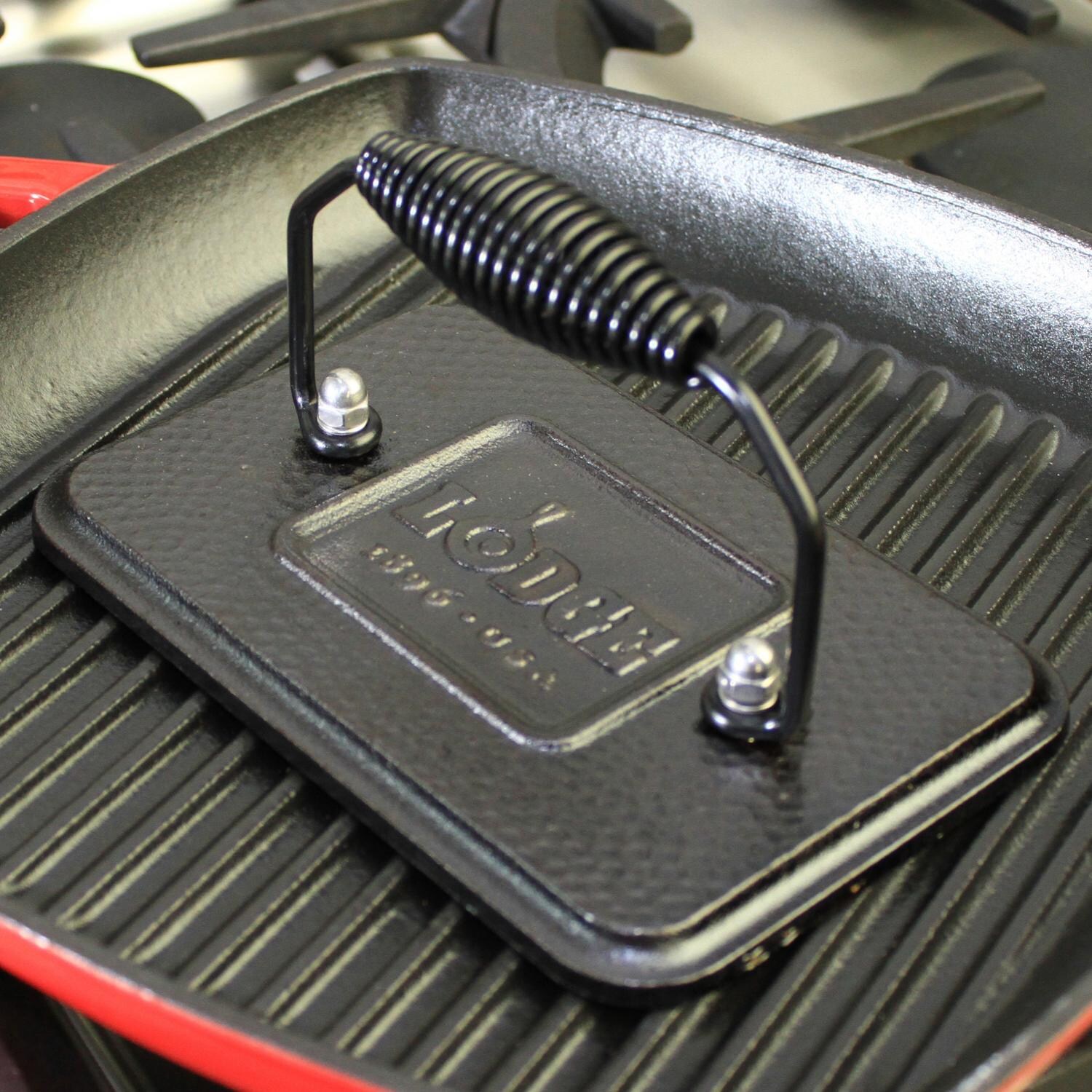 Lodge Grill Press Seasoned Cast Iron Grill Press In Use thumbnail