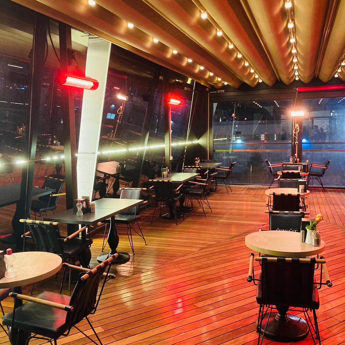 RADtec T6000/12R2 Torrid Series 56-in 6000W Electric Infrared Patio Heater - Restaurant Side View - Lifestyle thumbnail