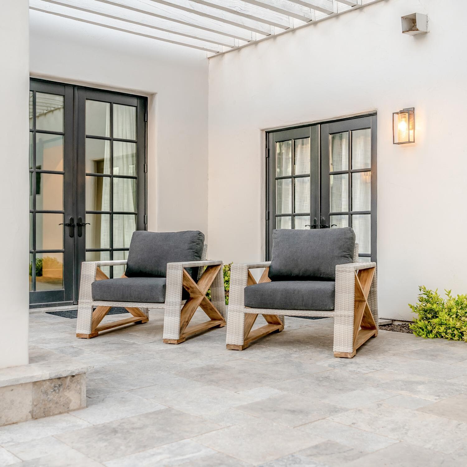 Teak + Table Caicos Club Chair in Granite - Shown On The Patio (Carbon Cushions Shown) - Lifestyle thumbnail