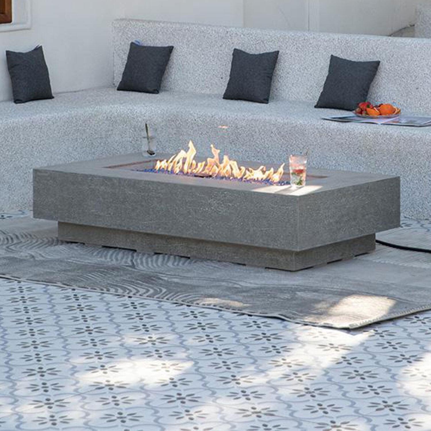 Riviera OFG415LG-LP 60 Inch Rectangular Concrete Propane Fire Pit Table in Gray By Elementi - Back Patio - Lifestyle thumbnail